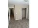 Bedroom with closet and access to other areas, featuring neutral carpet and paint at 9032 Maple Grove Dr, Summerville, SC 29485