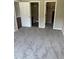 Spacious bedroom with neutral carpeting, connecting to an en-suite bathroom and walk-in closet at 9032 Maple Grove Dr, Summerville, SC 29485