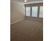 Bright bedroom featuring three windows and neutral carpeting with natural light at 9032 Maple Grove Dr, Summerville, SC 29485