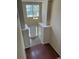 Bright foyer with hardwood and tile floors and a modern light fixture at 9032 Maple Grove Dr, Summerville, SC 29485