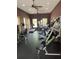 Well-equipped gym with treadmills, weight machines, and natural light from windows, perfect for staying active at 9032 Maple Grove Dr, Summerville, SC 29485
