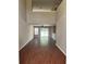 Spacious living room featuring high ceilings, hardwood floors, and sliding glass doors to the backyard at 9032 Maple Grove Dr, Summerville, SC 29485