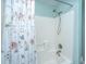 Bathroom featuring a tub and shower combination with white tile walls and a decorative shower curtain at 9042 Parlor Dr, Ladson, SC 29456