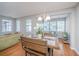 Bright dining area boasts hardwood floors and ample natural light from multiple windows at 9042 Parlor Dr, Ladson, SC 29456