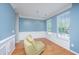 The airy dining room features a modern chandelier, chair rail and ample natural light at 9042 Parlor Dr, Ladson, SC 29456