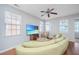 Cozy living room with a ceiling fan, large sectional, and plenty of natural light at 9042 Parlor Dr, Ladson, SC 29456