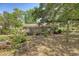 The backyard features mature trees, a large wooden deck, and plenty of space for outdoor enjoyment at 1012 Cliffwood Dr, Mount Pleasant, SC 29464
