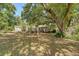 Spacious backyard with mature trees and a shed, providing shade and a tranquil environment at 1012 Cliffwood Dr, Mount Pleasant, SC 29464