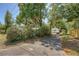 Long driveway leading to a detached garage, surrounded by lush landscaping and mature trees at 1012 Cliffwood Dr, Mount Pleasant, SC 29464