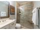 Bright bathroom with tiled shower, glass doors, and white vanity sink at 1025 Riverland Woods Pl # 906, Charleston, SC 29412