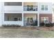 An attractive view of the rear exterior of this condo featuring screened in porches and balconies on both levels at 1025 Riverland Woods Pl # 906, Charleston, SC 29412