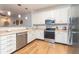 This bright kitchen has stainless appliances, lots of counter space, and white cabinets for ample storage at 1025 Riverland Woods Pl # 906, Charleston, SC 29412