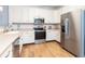 Bright kitchen with stainless appliances, a corner sink and ample cabinets is a cook's delight at 1025 Riverland Woods Pl # 906, Charleston, SC 29412
