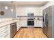 A brightly lit view of this kitchen shows off the stainless appliances and plenty of storage at 1025 Riverland Woods Pl # 906, Charleston, SC 29412