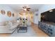 Bright living room featuring a large sofa, modern decor, and an open floor plan at 1025 Riverland Woods Pl # 906, Charleston, SC 29412