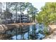 Scenic waterfront view of the community, featuring lush landscaping and inviting walking paths at 1025 Riverland Woods Pl # 906, Charleston, SC 29412