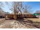 Home's backyard featuring a wooden patio and the exterior of a brick home at 119 Carolina Wren Ave, Ladson, SC 29456