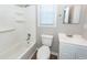 Cozy bathroom featuring a shower-tub, toilet, vanity with sink, mirror, and window for ample natural light at 119 Carolina Wren Ave, Ladson, SC 29456