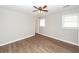 Bedroom featuring updated vinyl flooring, neutral paint, a ceiling fan, and natural light at 119 Carolina Wren Ave, Ladson, SC 29456