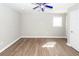 The bedroom features wood-look flooring, a ceiling fan, and a window at 119 Carolina Wren Ave, Ladson, SC 29456