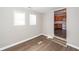 Bedroom featuring two windows and wood floors at 119 Carolina Wren Ave, Ladson, SC 29456