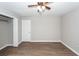 Bedroom featuring a ceiling fan, updated vinyl flooring, a closet, and neutral paint at 119 Carolina Wren Ave, Ladson, SC 29456