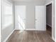 Bedroom featuring vinyl flooring, neutral paint, natural light, and a double closet at 119 Carolina Wren Ave, Ladson, SC 29456
