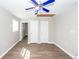 Spacious bedroom features wood-look flooring, ceiling fan, and neutral paint at 119 Carolina Wren Ave, Ladson, SC 29456