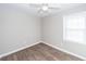 Bedroom featuring modern vinyl flooring, neutral paint, a ceiling fan, and natural light at 119 Carolina Wren Ave, Ladson, SC 29456