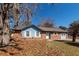 Charming single-story home with a brick facade, blue accents, and well-maintained landscaping at 119 Carolina Wren Ave, Ladson, SC 29456