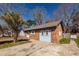 Charming single-story home with a brick and blue exterior, a well-maintained lawn, and a driveway at 119 Carolina Wren Ave, Ladson, SC 29456