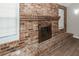 Close-up of a brick fireplace with windows on either side at 119 Carolina Wren Ave, Ladson, SC 29456