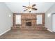 Living room boasting brick fireplace, neutral walls, and a ceiling fan at 119 Carolina Wren Ave, Ladson, SC 29456
