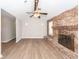 Spacious living room featuring brick fireplace and updated flooring at 119 Carolina Wren Ave, Ladson, SC 29456