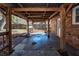 Covered patio attached to a brick home, offering an outdoor living space and backyard view at 119 Carolina Wren Ave, Ladson, SC 29456
