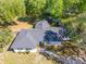 Desirable single-story home with mature trees, an expansive lawn, and a long paved driveway at 1128 Melvin Bennett Rd, Mount Pleasant, SC 29464