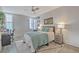 Bright bedroom features a cozy bed, ceiling fan, and natural light at 14 Lockwood Dr # 11H, Charleston, SC 29401