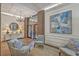 A decorated lobby area with brick walls, tile floor, decorative lamps, furniture, and modern art at 14 Lockwood Dr # 11H, Charleston, SC 29401