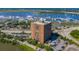 Aerial view showcasing the condo building with boat docks, harbor, water, and bridges in the distance at 14 Lockwood Dr # 2D, Charleston, SC 29401