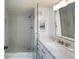 Modern bathroom with a glass shower, decorative tiles, and a vanity with marble countertop at 14 Lockwood Dr # 2D, Charleston, SC 29401