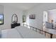 Bedroom featuring a TV, a dresser with mirror, and an open doorway to the living area at 14 Lockwood Dr # 2D, Charleston, SC 29401