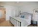 Comfortable bedroom with light walls, wrought iron bed frame, and ample closet space at 14 Lockwood Dr # 2D, Charleston, SC 29401