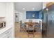View of the dining room showcasing a wood table and direct access to the kitchen at 14 Lockwood Dr # 2D, Charleston, SC 29401