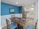 Inviting dining room with wood table, blue accents, and direct access to the kitchen at 14 Lockwood Dr # 2D, Charleston, SC 29401