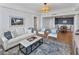 Cozy living room connects to dining area, features shiplap, stylish furniture, and ample natural light at 14 Lockwood Dr # 2D, Charleston, SC 29401