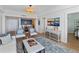 Charming living room with a view, shiplap walls, stylish decor, and seamless access to dining area at 14 Lockwood Dr # 2D, Charleston, SC 29401
