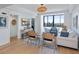 Inviting living room features a water view, tasteful decor, shiplap walls, and beachy-chic accents at 14 Lockwood Dr # 2D, Charleston, SC 29401