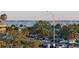 Beautiful water view overlooking palm trees, boat docks, parking, and boats sailing on the horizon at 14 Lockwood Dr # 2D, Charleston, SC 29401