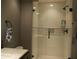 Modern bathroom with glass-enclosed shower, and sleek fixtures at 141 Marsh View Villas, Folly Beach, SC 29439