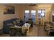Cozy living room with comfortable seating and views of the landscape at 141 Marsh View Villas, Folly Beach, SC 29439